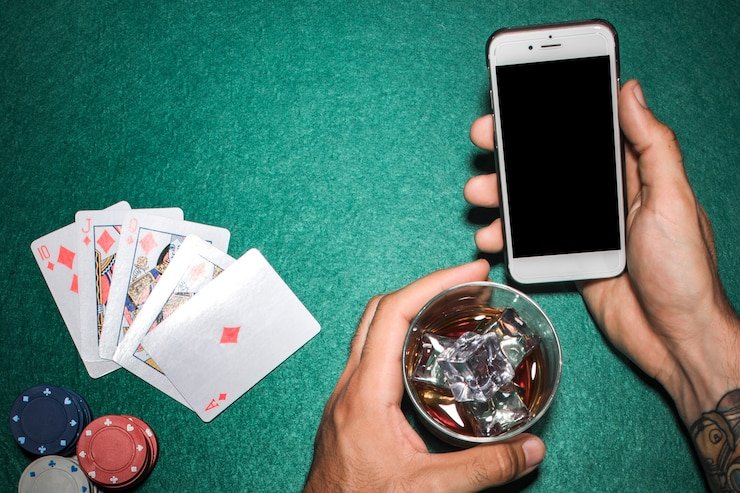 Chip stacks and betting limits vary by table Player chips stacked at rajasepin live poker table showing different denominations
